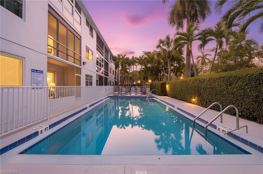 72 7th Street South, Unit 206 Naples, FL 34102 - Photo 2 of 38 a view of swimming pool with a yard