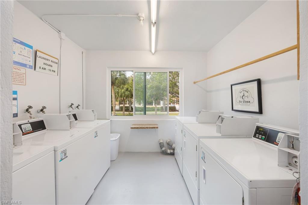 72 7th Street South, Unit 206 Naples, FL 34102 - Photo 21 of 38 a bathroom with a sink and a large mirror