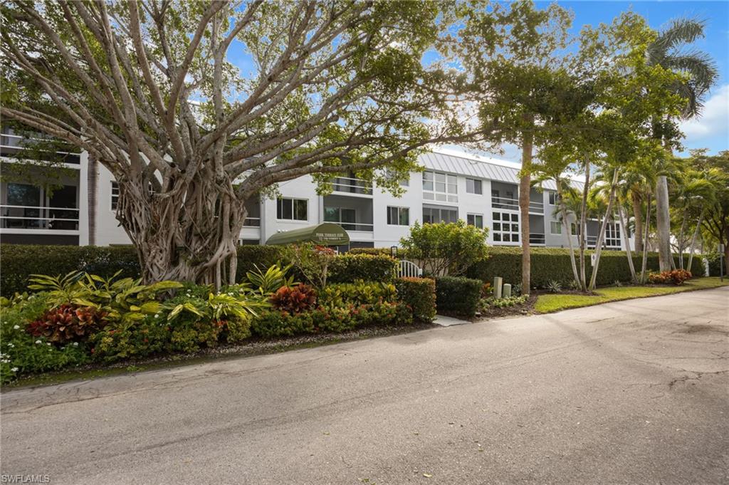 72 7th Street South, Unit 206 Naples, FL 34102 - Photo 27 of 38 a view of a house with a garden