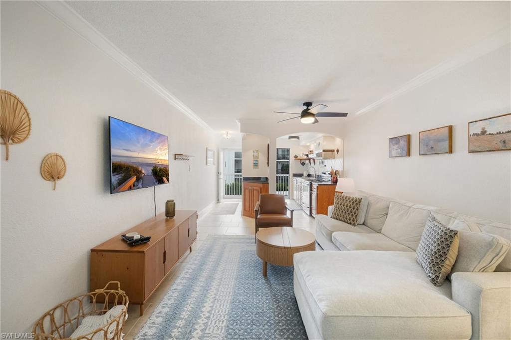 72 7th Street South, Unit 206 Naples, FL 34102 - Photo 6 of 38 a living room with furniture and a wooden floor