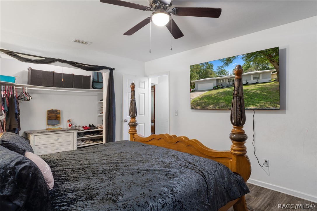 1140 South Highlands Avenue Inverness, FL 34452 - Photo 29 of 54 a bedroom with a bed and a large window