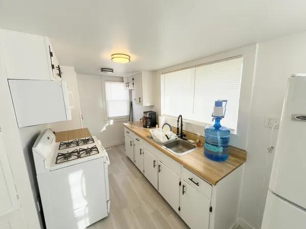 a kitchen with sink cabinets and window