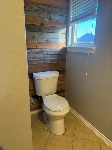 a bathroom with a toilet and a sink