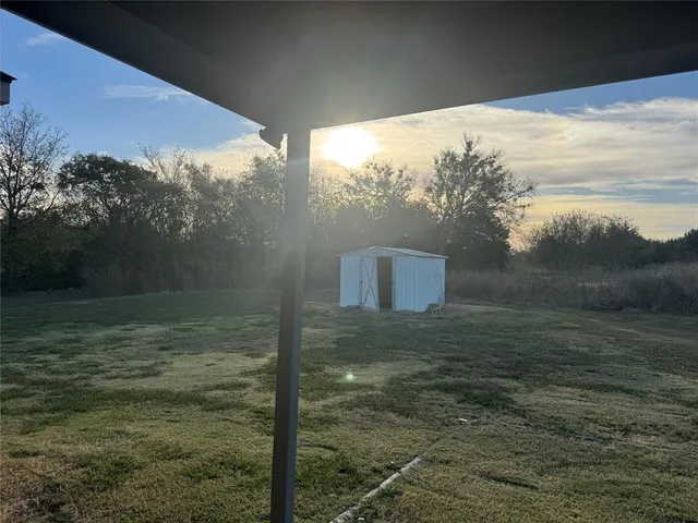 a view of a wooden floor and a lake view