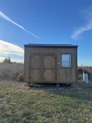 a view of backyard with potted plants