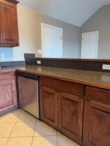 a view of a kitchen with a sink stainless steel appliances and cabinets