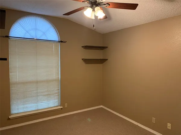 en empty room with wooden floor