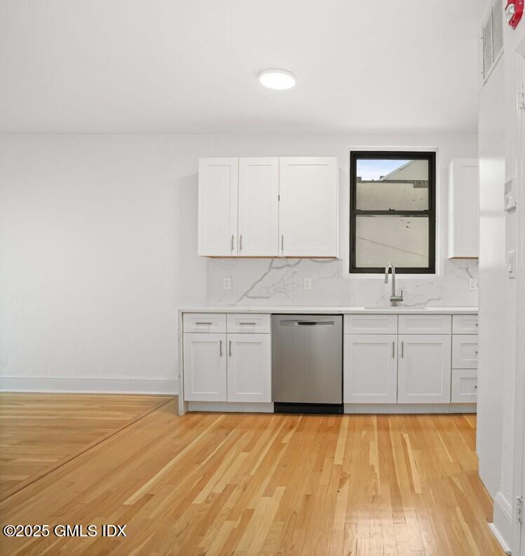 169 Greenwich Avenue, Unit FRONT Greenwich, CT 06830 - Photo 4 of 22 a view of a kitchen with microwave and sink