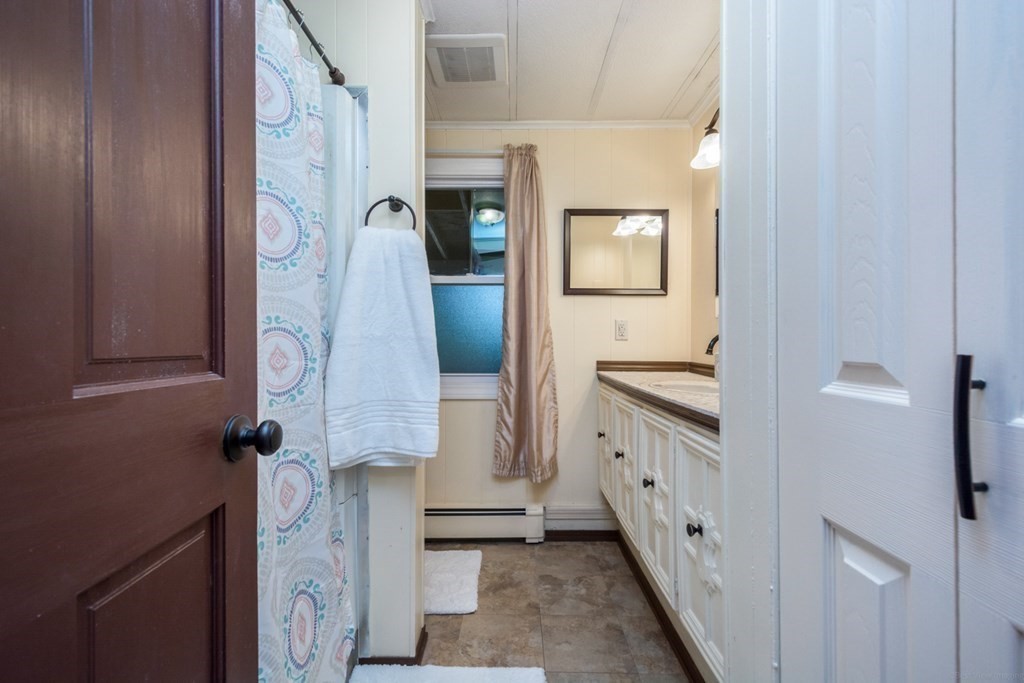2 Lakeside Avenue Webster, MA 01570 - Photo 20 of 27 a bathroom with a double vanity sink and mirror