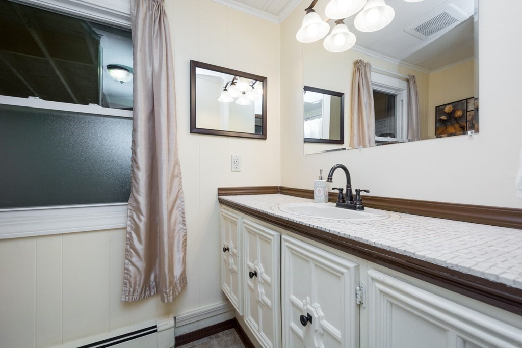 2 Lakeside Avenue Webster, MA 01570 - Photo 21 of 27 a bathroom with a sink and a mirror