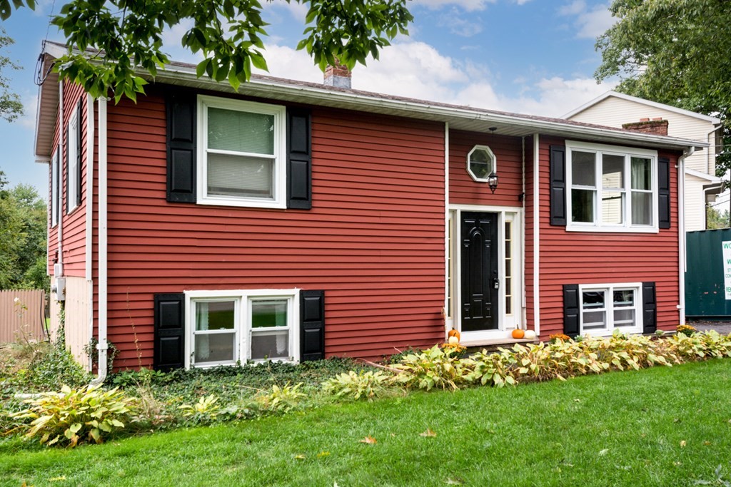 2 Lakeside Avenue Webster, MA 01570 - Photo 3 of 27 a front view of a house with a garden