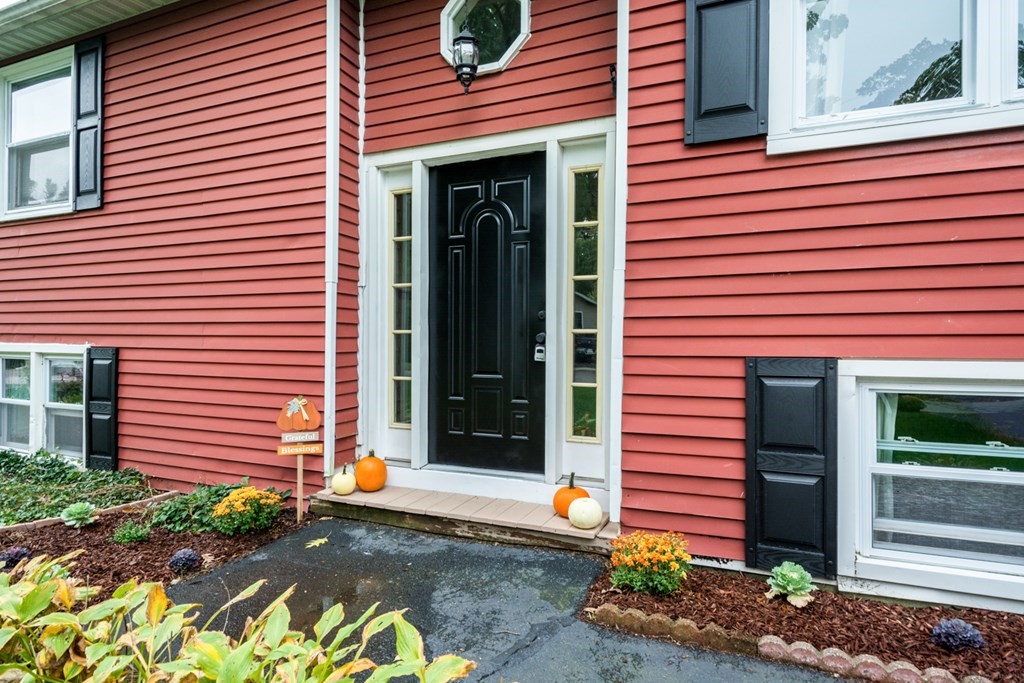 2 Lakeside Avenue Webster, MA 01570 - Photo 4 of 27 a front view of a house with a yard