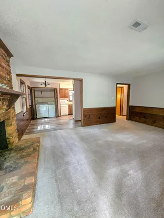 a view of an empty room with windows