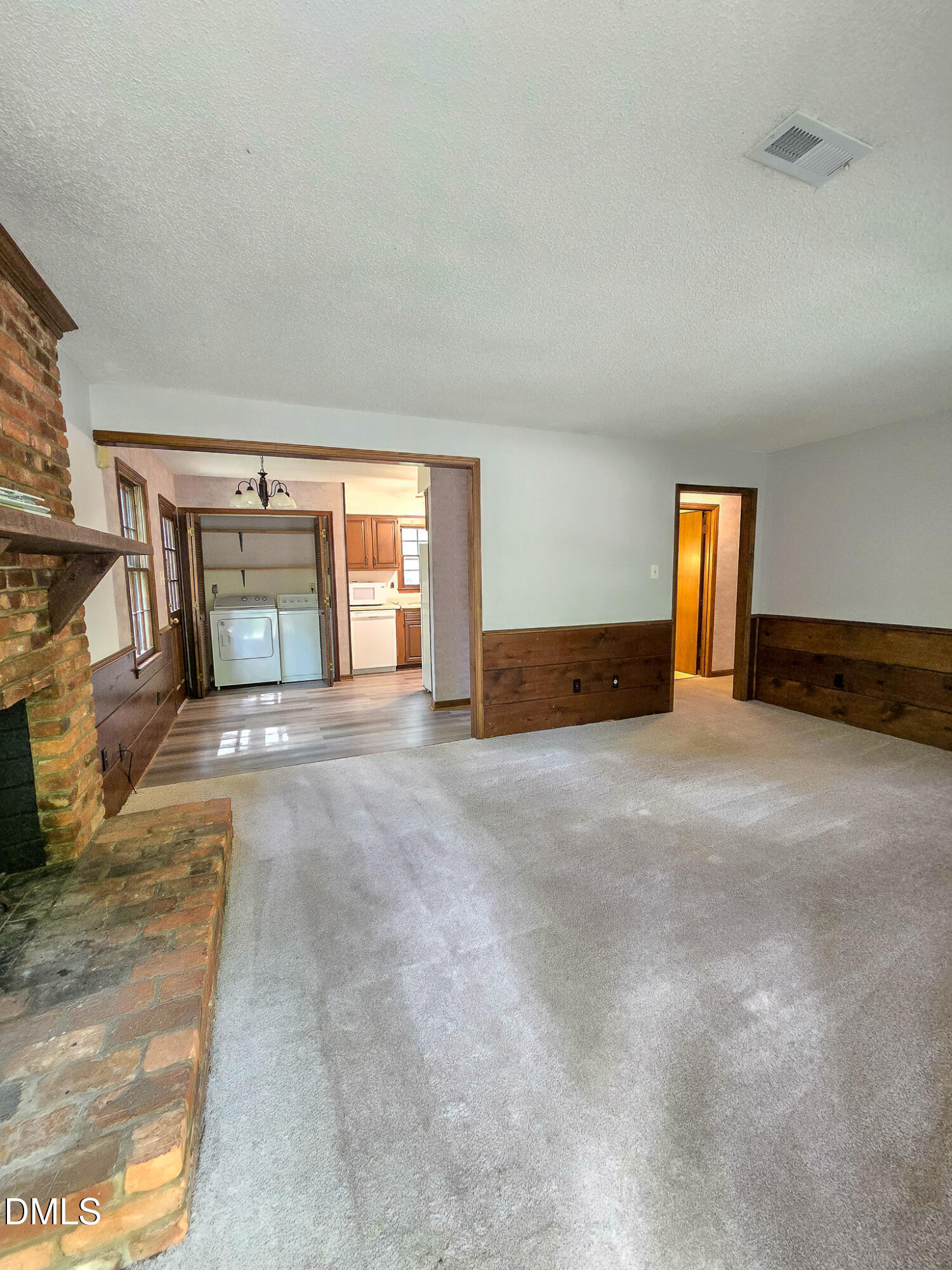 3909 Greenleaf Street Raleigh, NC 27606 - Photo 2 of 27 a view of an empty room with windows