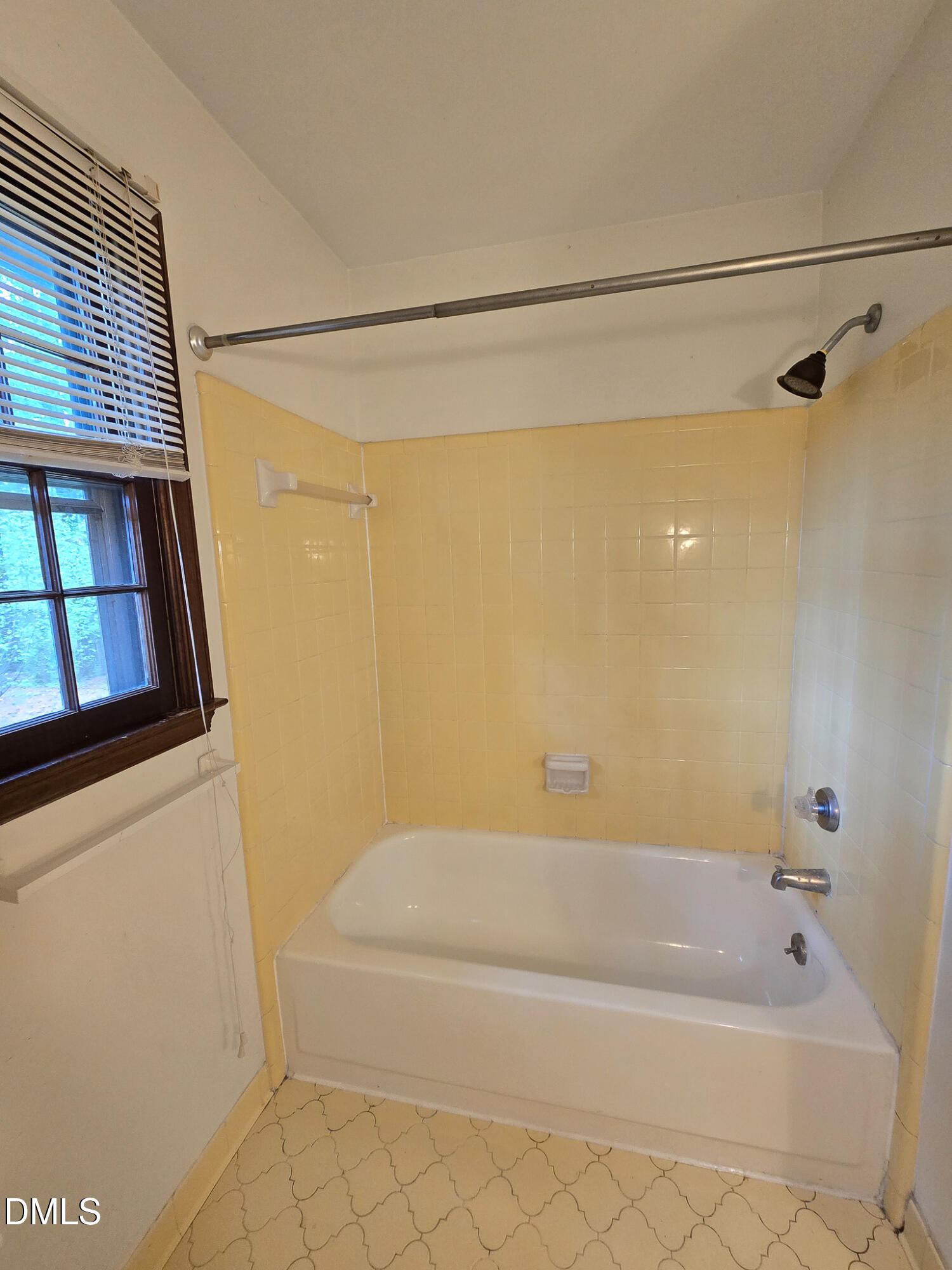 3909 Greenleaf Street Raleigh, NC 27606 - Photo 22 of 27 a bathroom with a bathtub and a shower