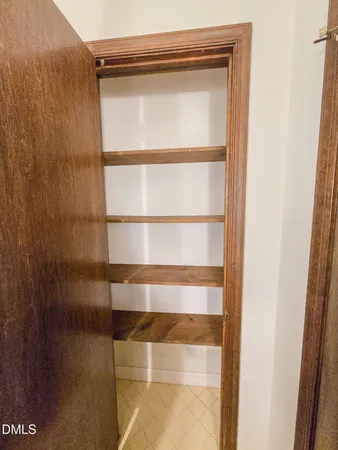 a view of a backyard with large trees