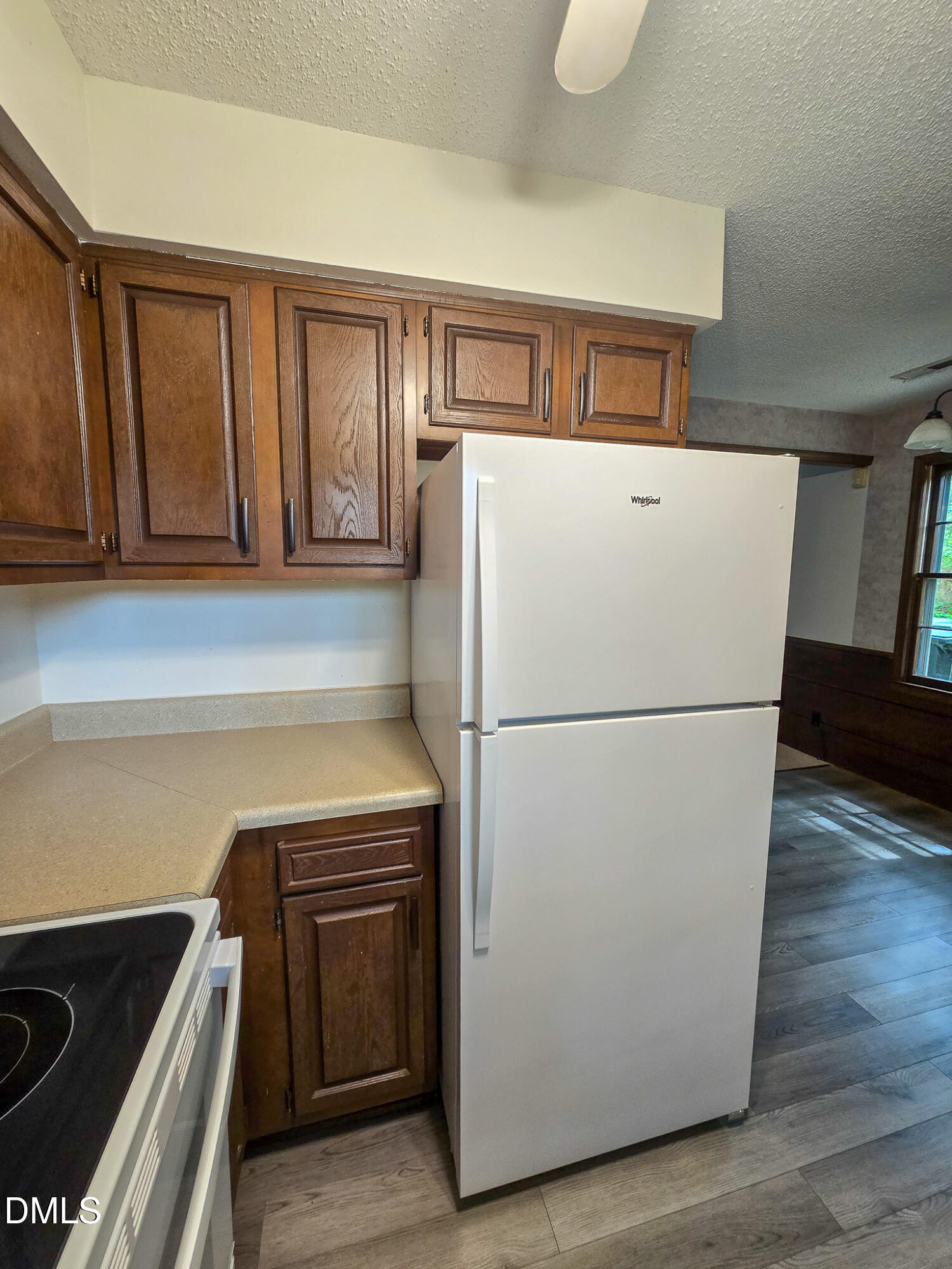 3909 Greenleaf Street Raleigh, NC 27606 - Photo 8 of 27 a white refrigerator freezer and a stove sitting inside of a kitchen