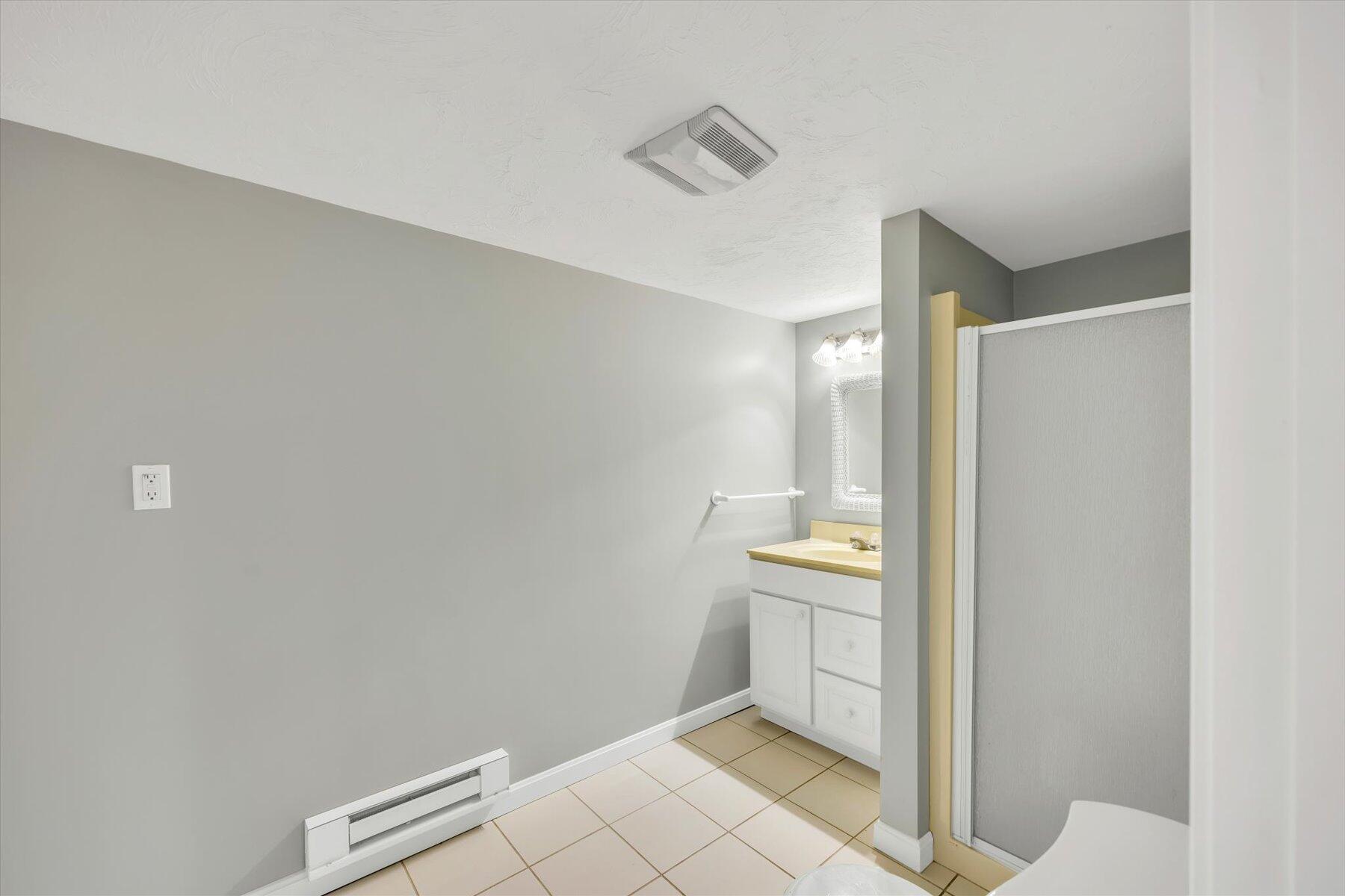 59 Oregon Road Mashpee, MA 02649 - Photo 31 of 34 a bathroom with a sink mirror and a toilet