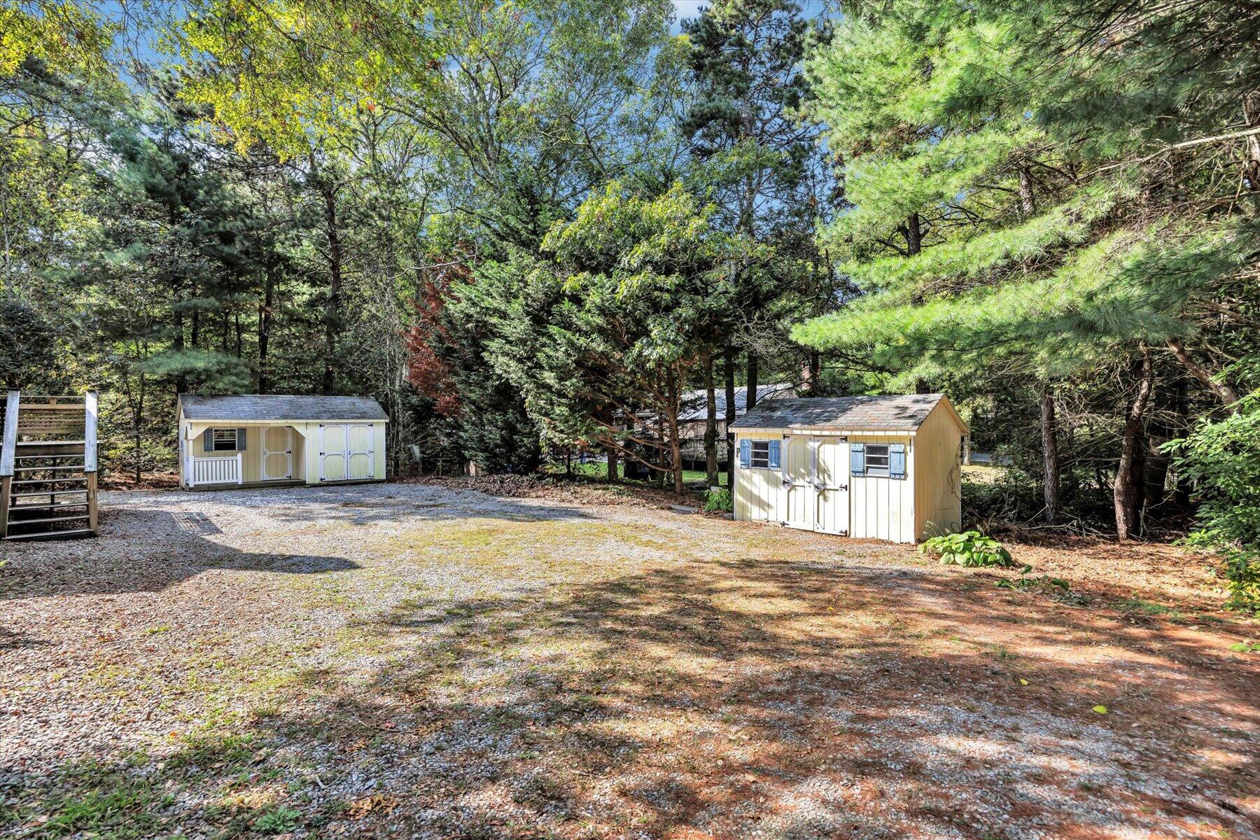 59 Oregon Road Mashpee, MA 02649 - Photo 4 of 34 a house with trees in front of it
