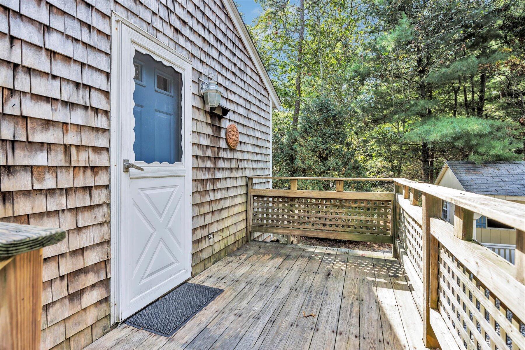 59 Oregon Road Mashpee, MA 02649 - Photo 7 of 34 a balcony view with a seating space