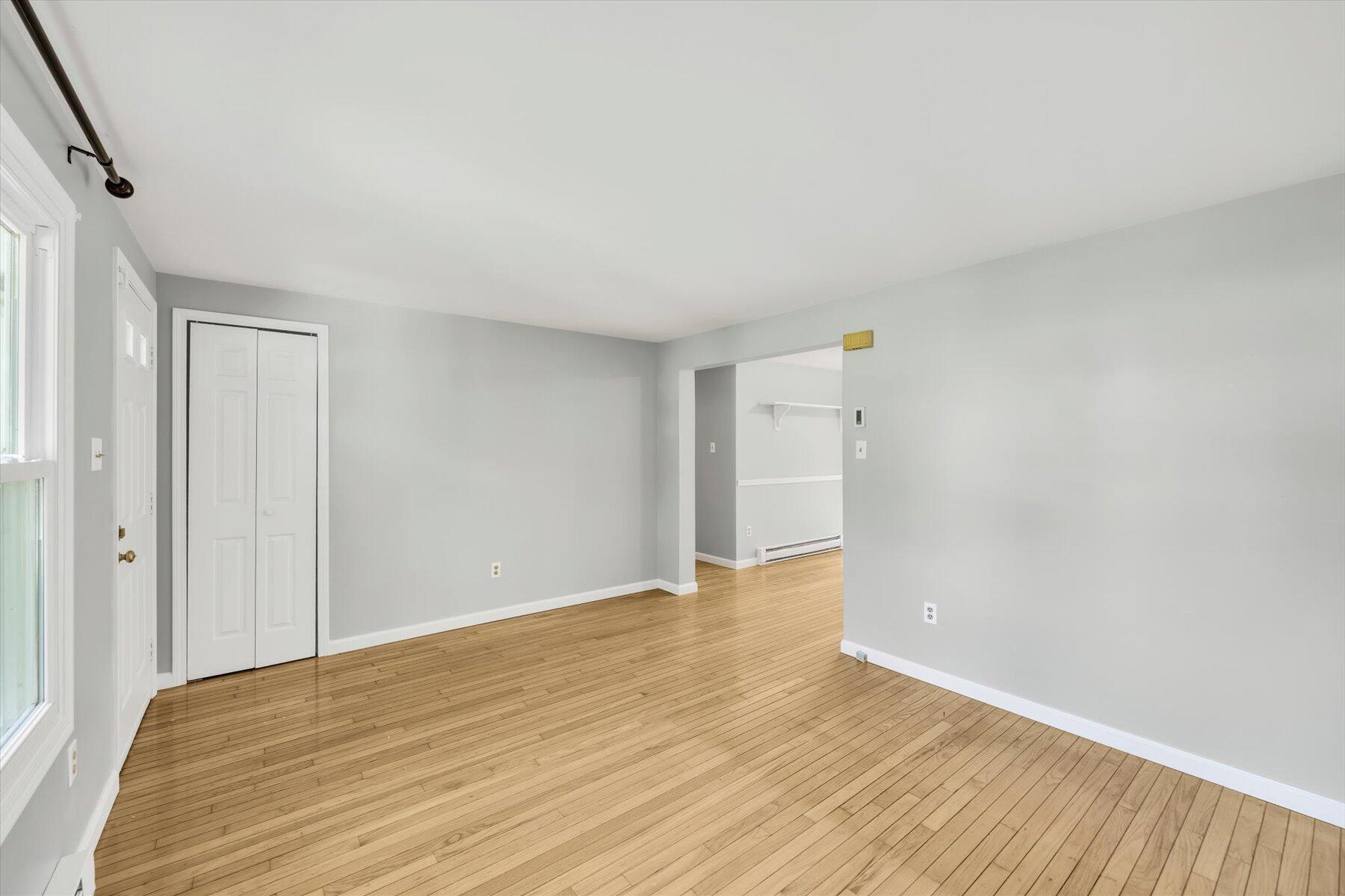 59 Oregon Road Mashpee, MA 02649 - Photo 10 of 34 a view of an empty room with wooden floor and a window
