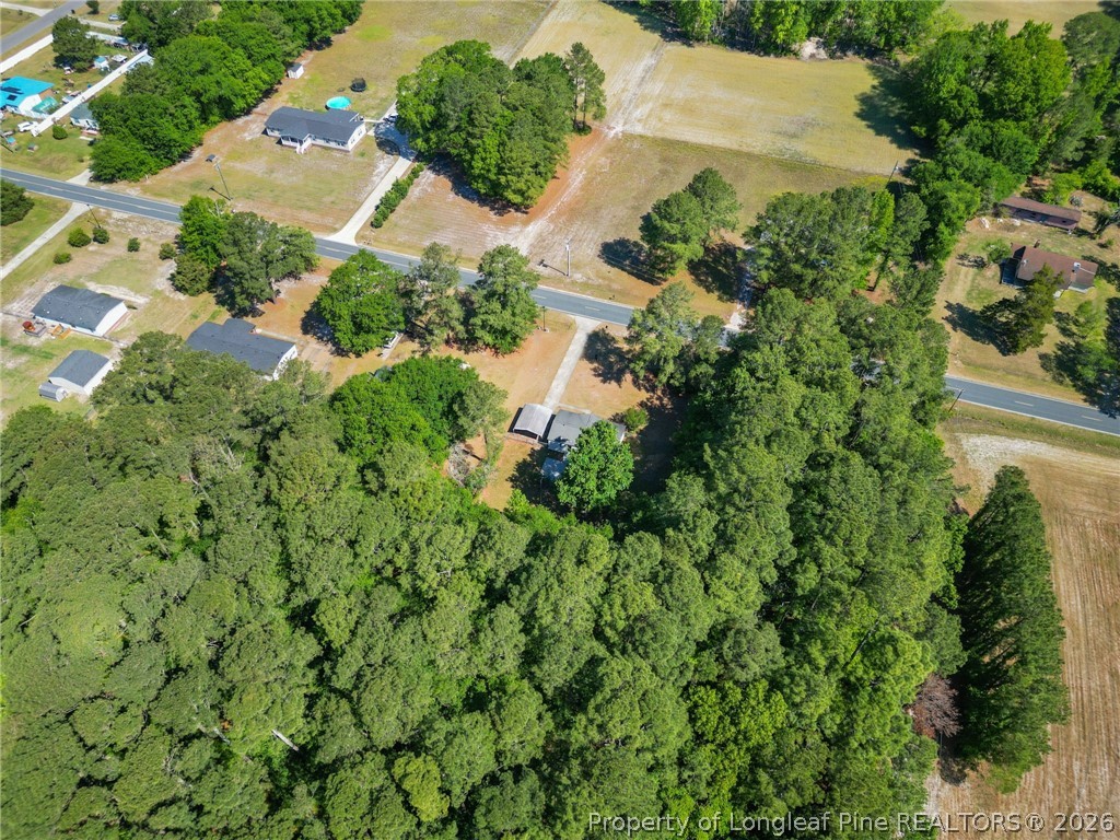 6568 Sandy Creek Road Stedman, NC 28391 - Photo 33 of 34 an aerial view of residential house with outdoor space and trees all around
