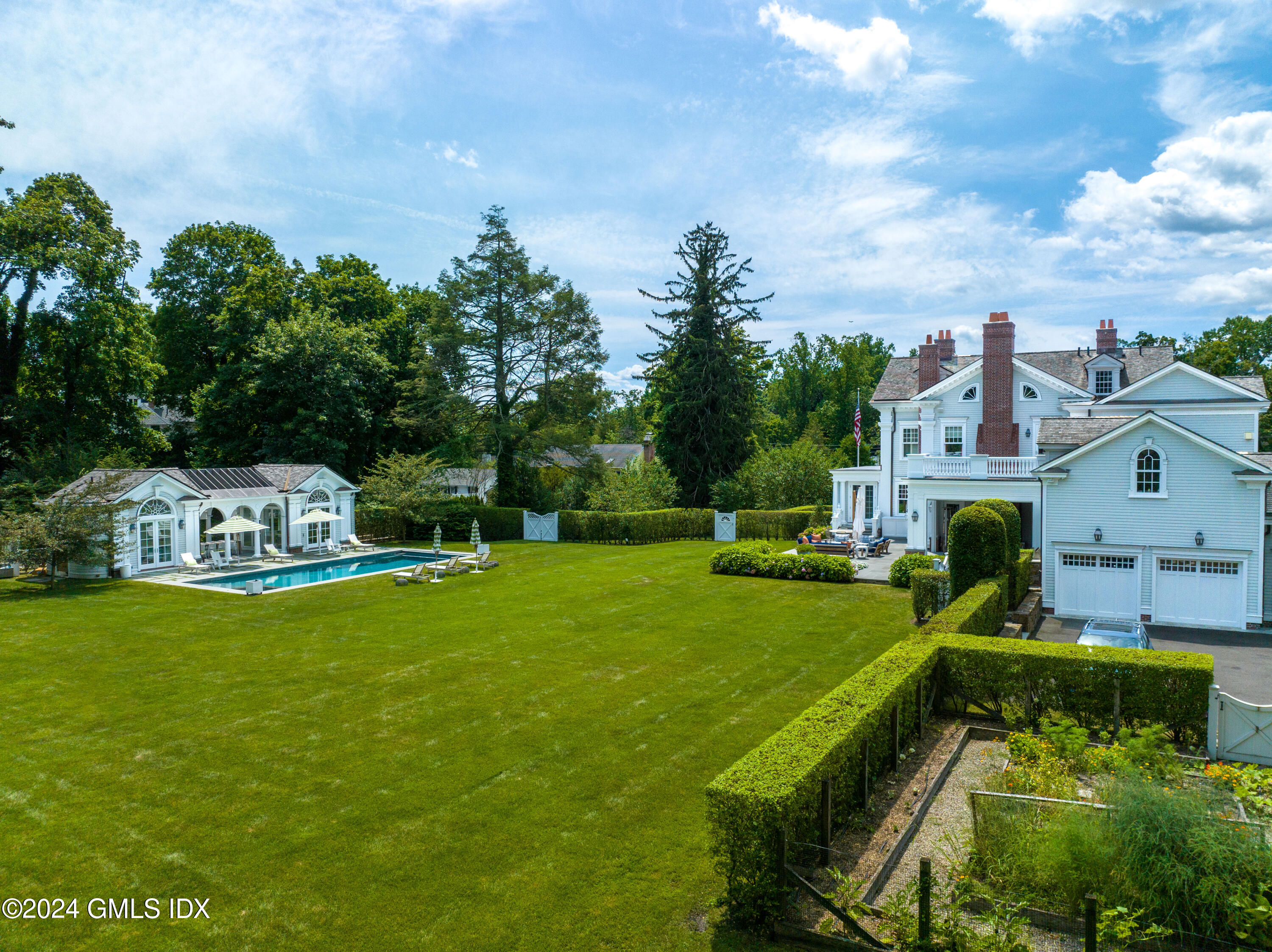 101 Brookside Drive Greenwich, CT 06831 - Photo 4 of 6 a view of a house with a big yard