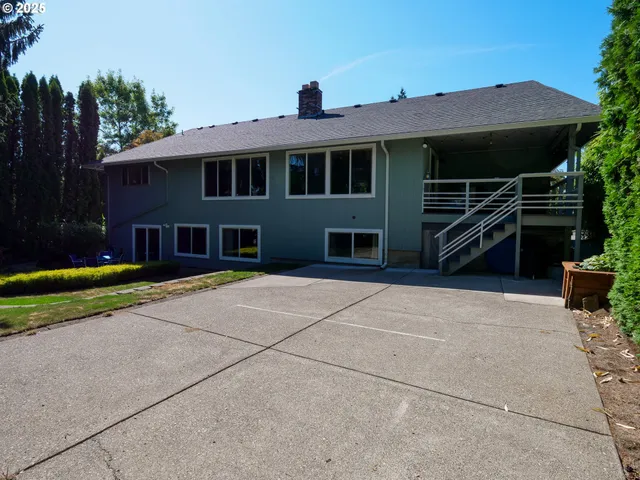 a front view of a house with a yard table and chairs