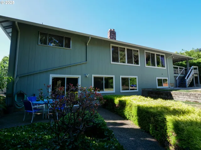 a view of a two room with wooden floor and outdoor space