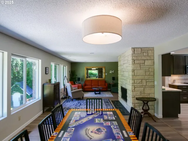 a living room with furniture flat screen tv and a fireplace