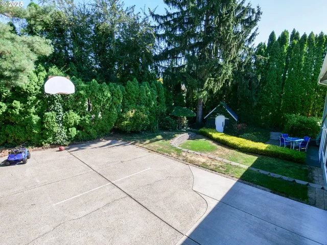 a front view of a house with a yard and a garage