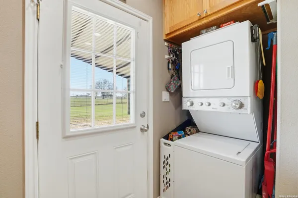 a view of bathroom with washer and dryer