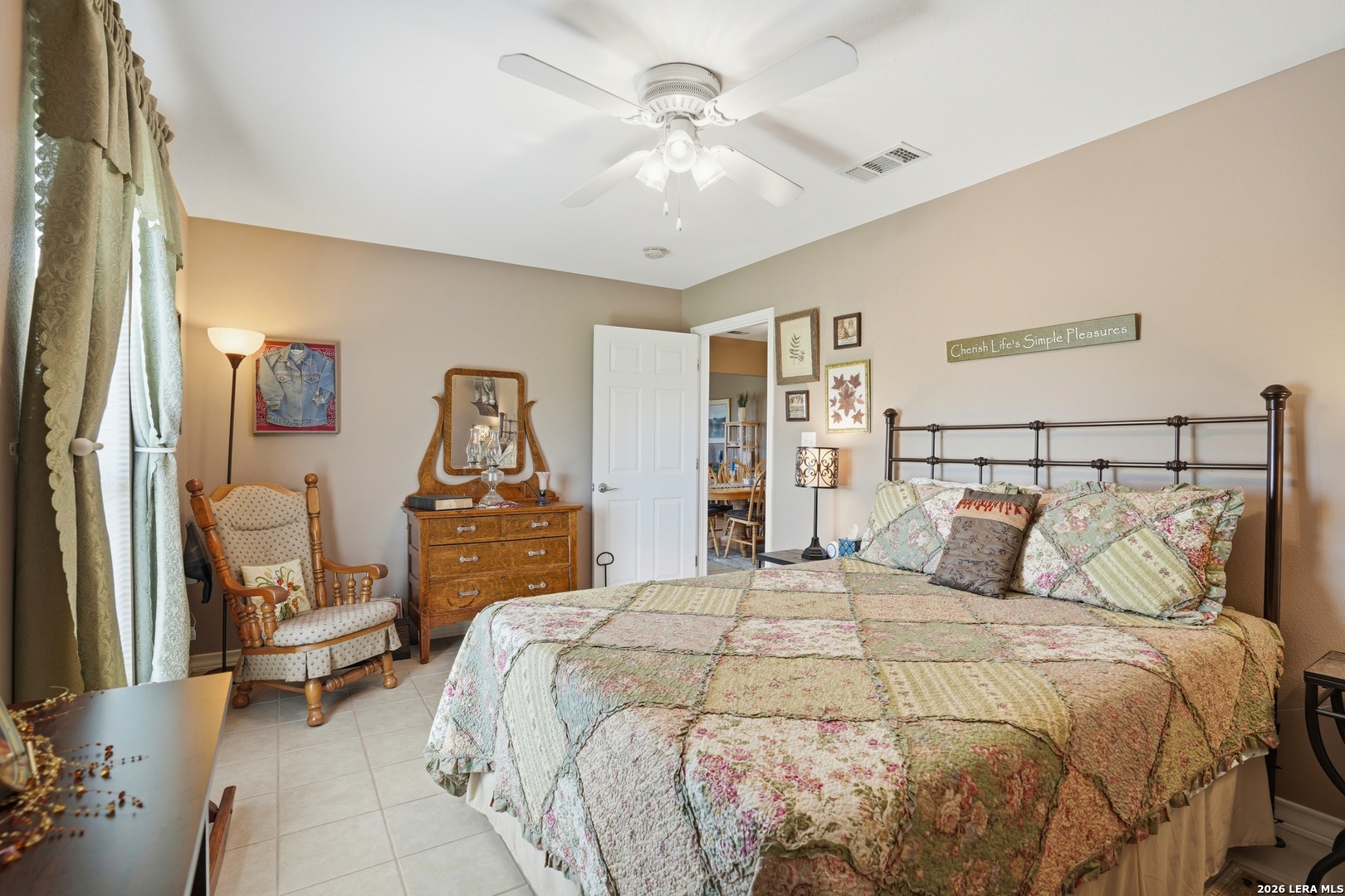 293 Woodrow Center Road Kingsbury, TX 78638 - Photo 15 of 50 a bedroom with a large bed and a chandelier