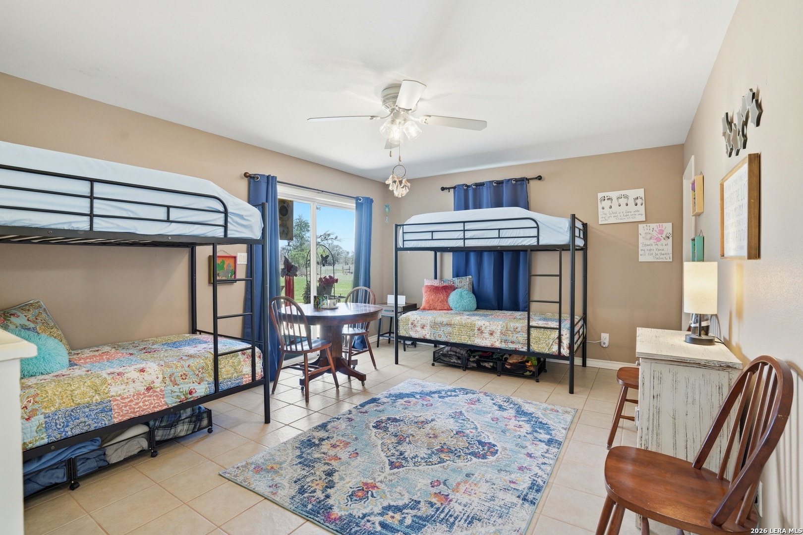 293 Woodrow Center Road Kingsbury, TX 78638 - Photo 17 of 50 a bedroom with a bed chair and a window