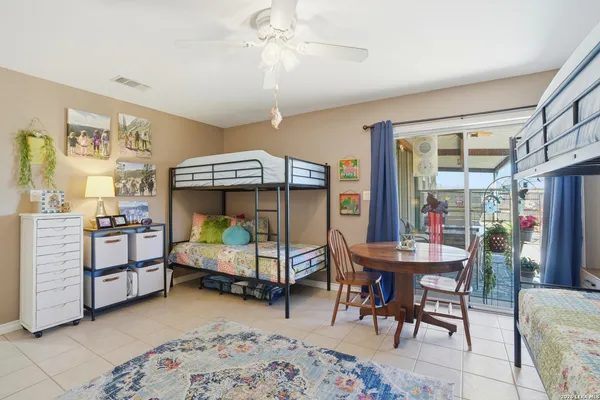 a bedroom with furniture and a window