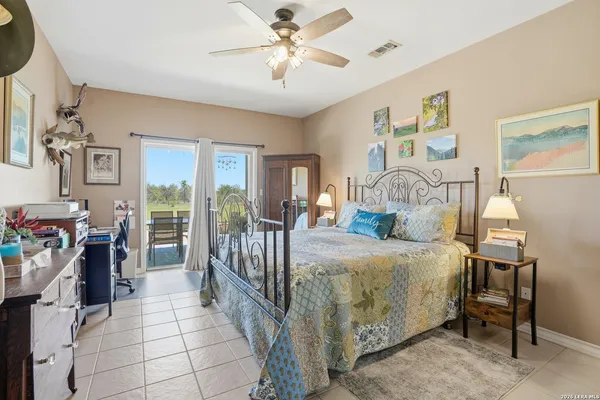 a bed room with a bed and a chandelier