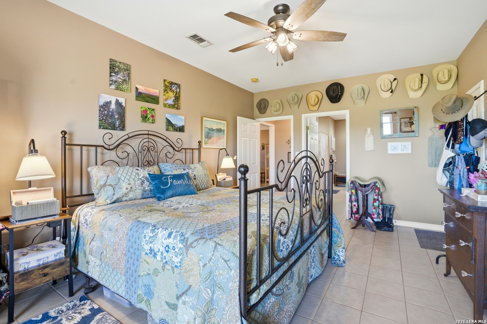 293 Woodrow Center Road Kingsbury, TX 78638 - Photo 22 of 50 a bedroom with a bed and ceiling fan