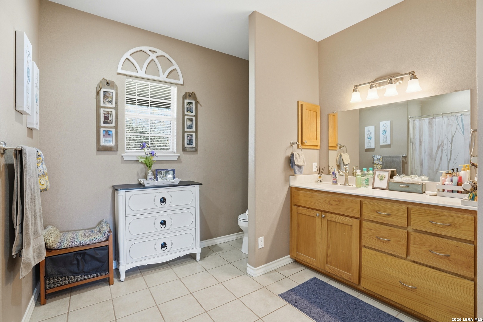293 Woodrow Center Road Kingsbury, TX 78638 - Photo 23 of 50 a spacious bathroom with a double vanity sink a mirror and a bathtub