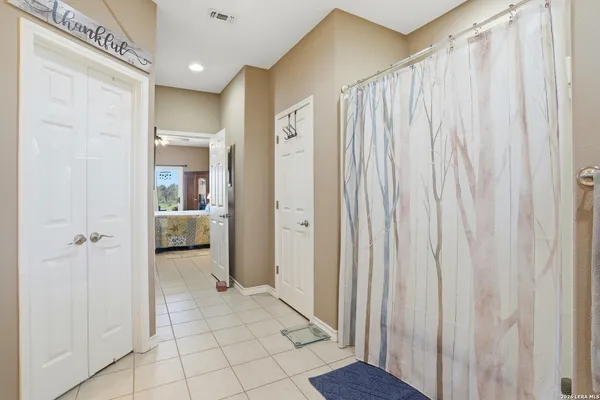 a view of a bathroom with a shower and a sink