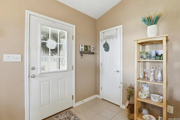 a view of room with window and wooden floor
