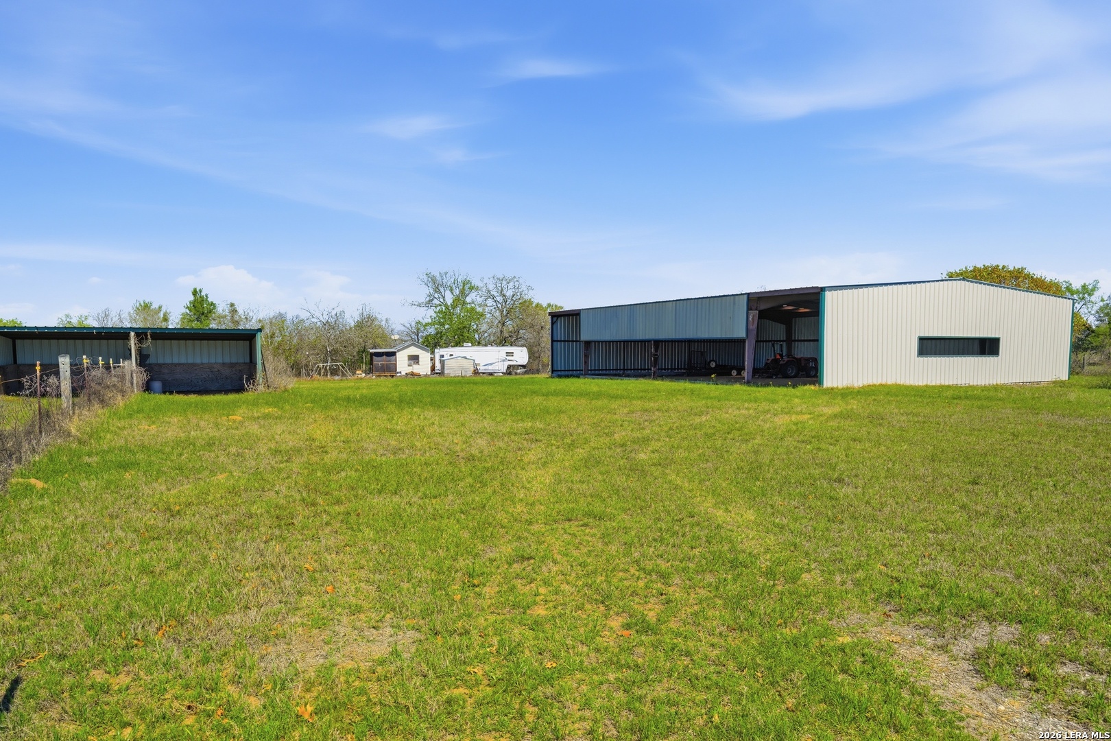 293 Woodrow Center Road Kingsbury, TX 78638 - Photo 41 of 50 a view of a backyard with plants and large trees