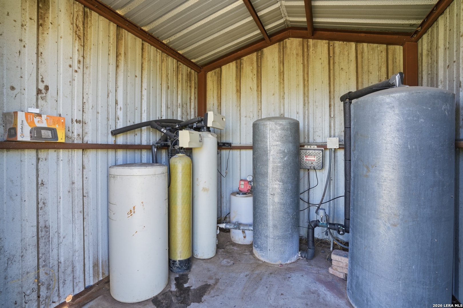 293 Woodrow Center Road Kingsbury, TX 78638 - Photo 46 of 50 a view of a hallway with wooden shelves