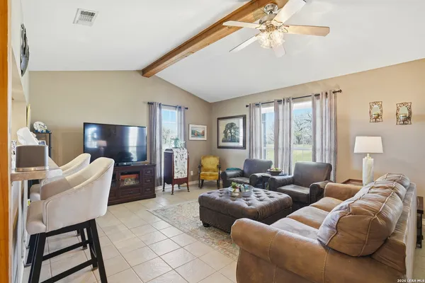 a living room with furniture and a window