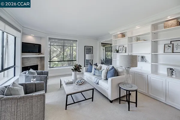 a living room with furniture fireplace and a flat screen tv