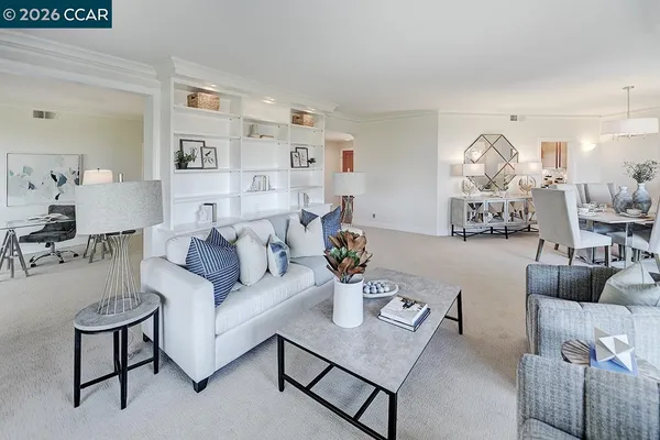 a view of livingroom with furniture and white cabinets