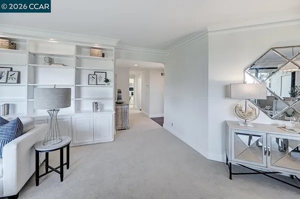 a spacious bedroom with a bed and a couch