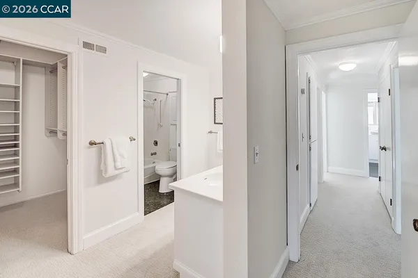 a bathroom with a sink mirror toilet and shower