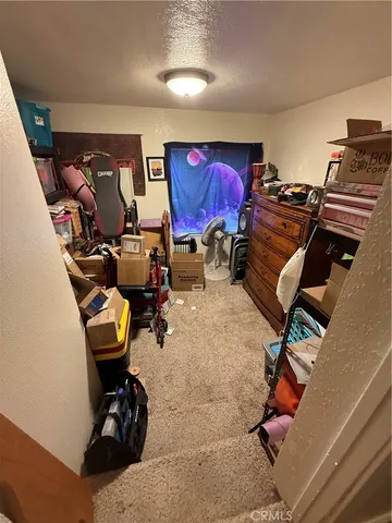 a room with furniture and gym equipment