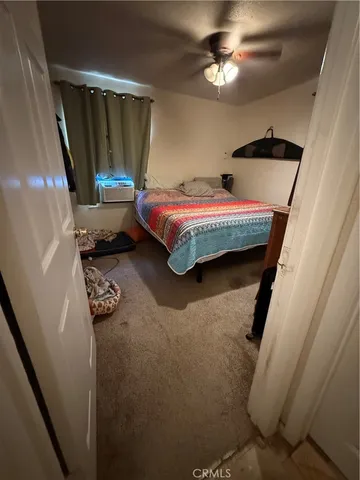 a close view of a sink and dishwasher with wooden floor