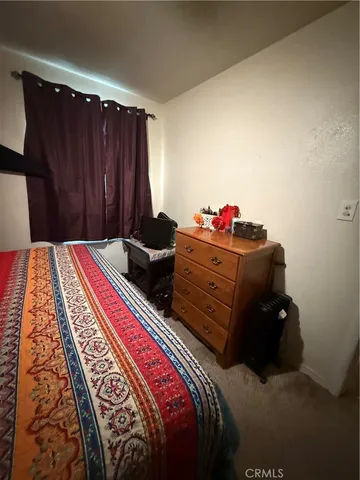 a room with lots of chairs and a fan